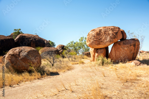 Large rock formations on top of one another along path