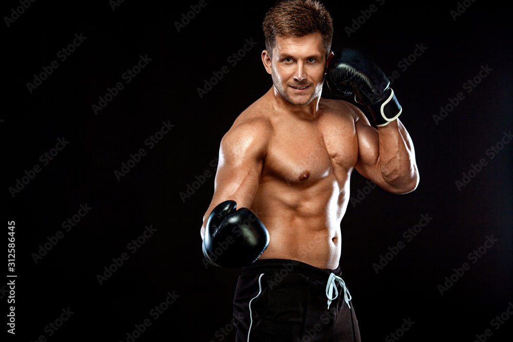 Fitness and boxing concept. Boxer, man fighting or posing in gloves on dark background. Individual sports recreation.