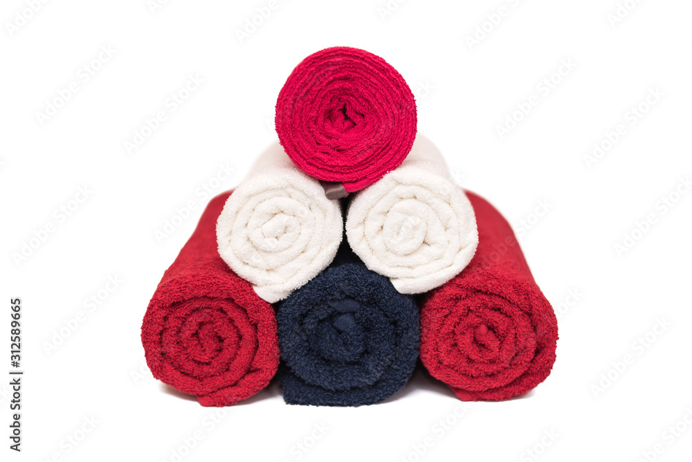 Rolled up clean soft bath towels on white background. Closeup. Copy space Rolled up clean soft bath towels on white background. Closeup. Copy space