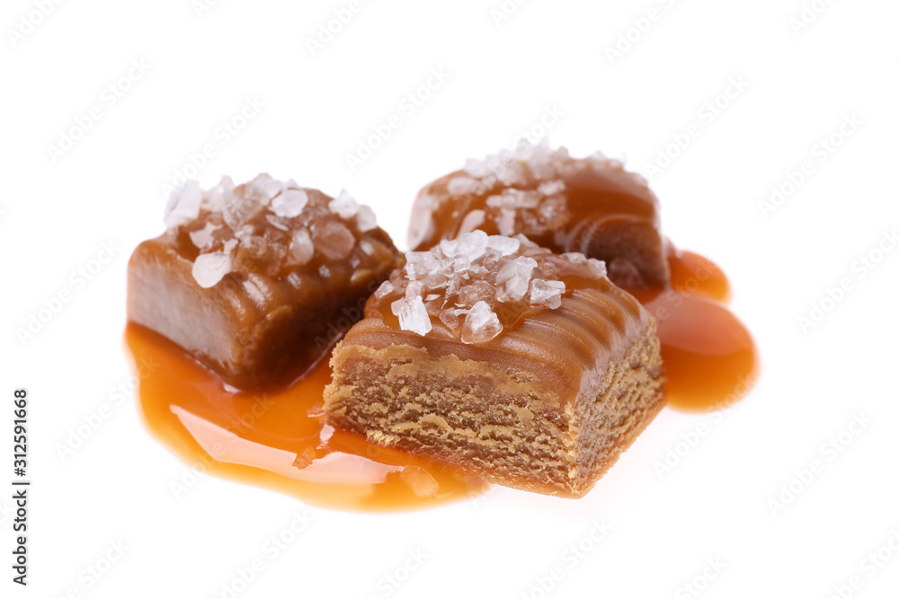 Delicious salted caramel with sauce on white background Delicious salted caramel with sauce on white background