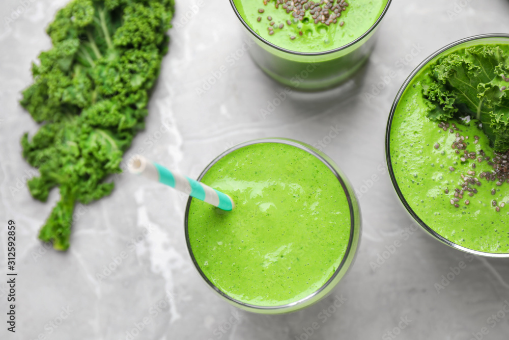 Tasty kale smoothie on light grey marble table, flat lay Tasty kale smoothie on light grey marble table, flat lay
