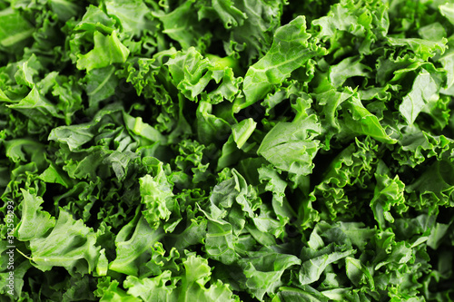 Fresh green kale leaves as background, closeup