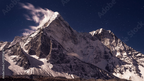 Ama Dablam under stars, is mountain in Himalaya range of eastern Nepal, 6,812m