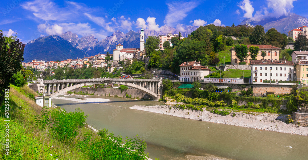 Travel in northern Italy - beautiful Belluno town surrounded by impressive Dolomite mountains