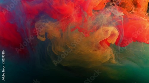 Color paint drops in water , abstract color mix , drop of Ink color mix paint falling on water Colorful ink in water, 4K footage,