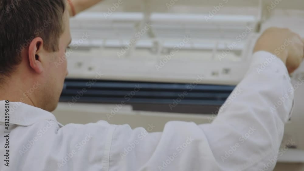 Professional cleaning of home air conditioner from contamination by