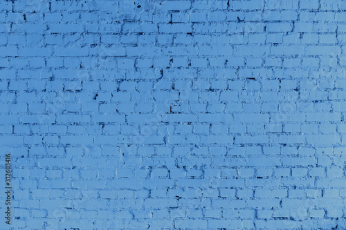 Deep blue Brick wall texture close up. Modern wallpaper design for web or graphic art project. Trendy banner toned in classic blue - color of the 2020 year