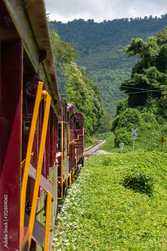 A locomotive travels through the countryside in the mountains of North Carolina.