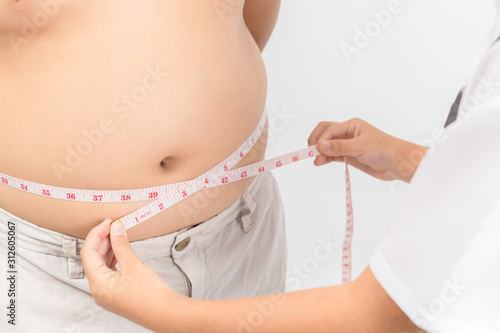 Little doctor measuring obese child waist body fat isolated