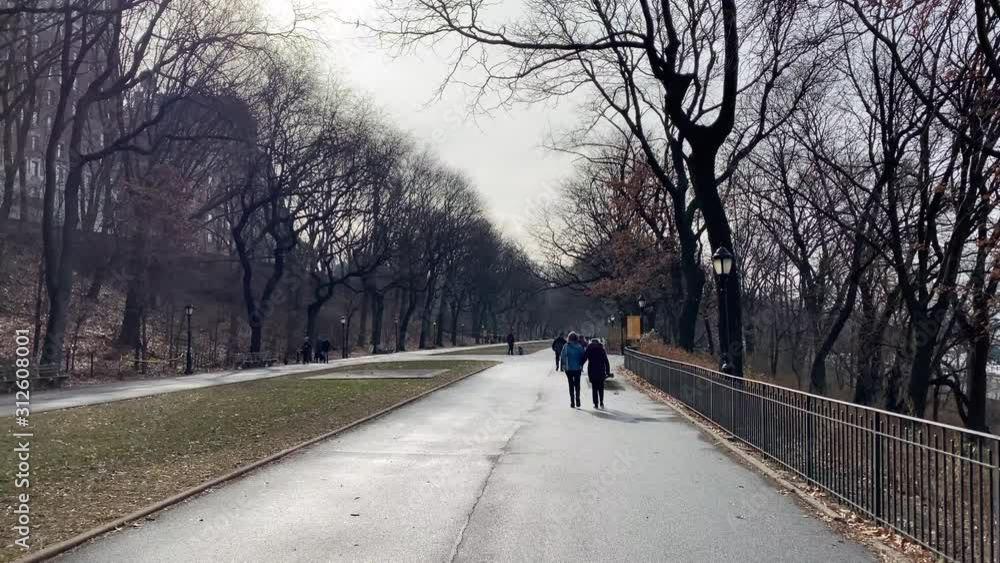 Unidentified woman and elderly woman walk on the The Hudson River Greenway Park on the Upper West Side of New York City. Unidentified woman and elderly woman walk on the The Hudson River Greenway Park on the Upper West Side of New York City.