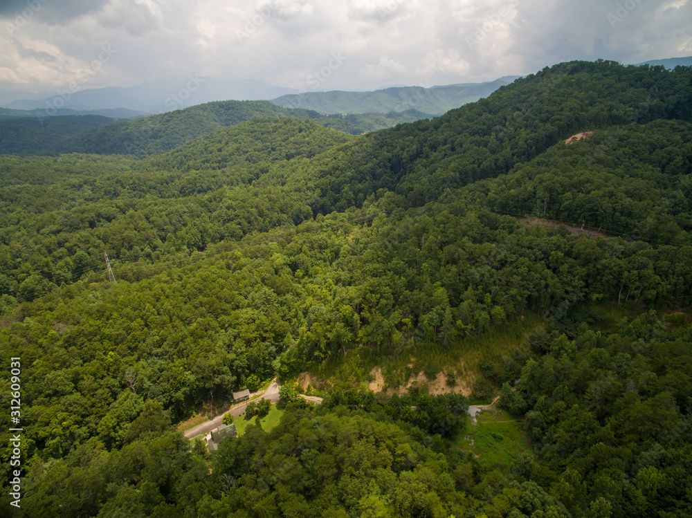 A drone aerial view of deep countryside with lush greens in the tourist area of Pigeon Forge Tennessee