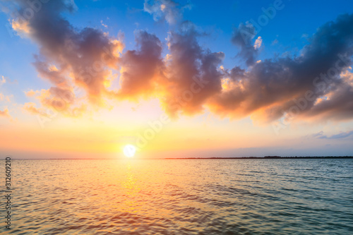 Dreamy sunset landscape by the lake