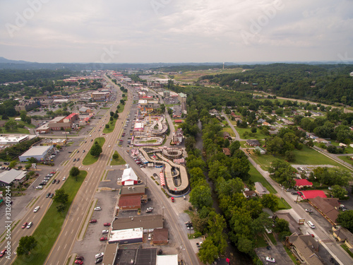 A drone, aerial view of the main road with many tourist attractions in the city of Pigeon Forge Tennessee