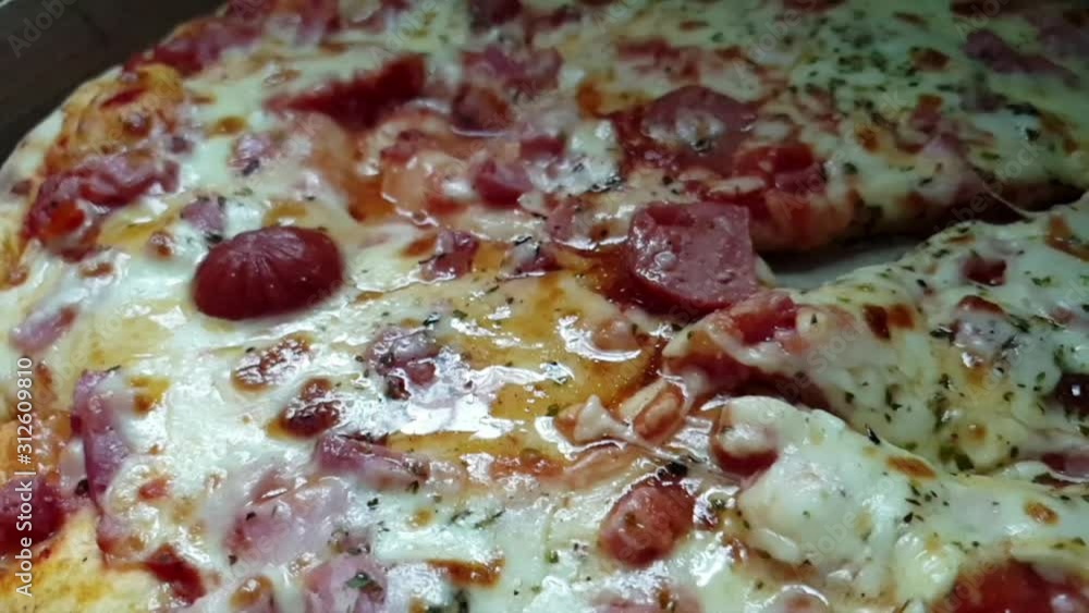 Pizza perfect, extra melting cheddar cheese, extra salami and pepperoni toppings served hot,sliced with a stainless steel serrated knife. Pizza perfect, extra melting cheddar cheese, extra salami and pepperoni toppings served hot,sliced with a stainless steel serrated knife.