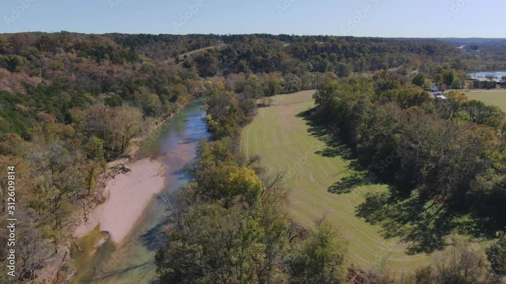 Aerial view of river running along the wooded hillside Aerial view of river running along the wooded hillside