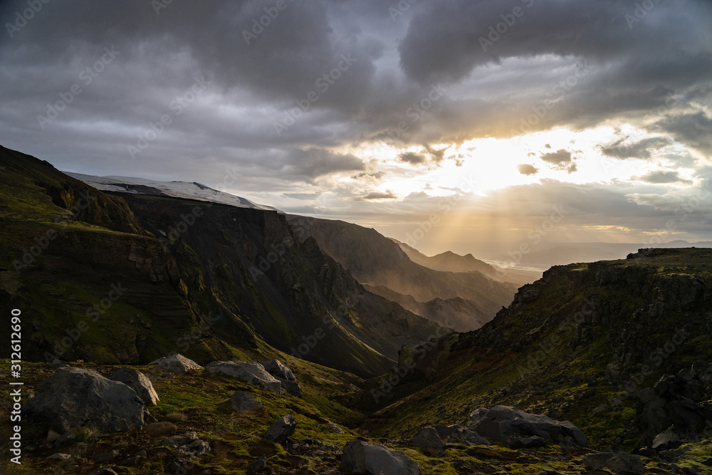 Green canyon and Mountain during dramatic and colorful sunset on the Fimmvorduhals Hiking trail near Thorsmork