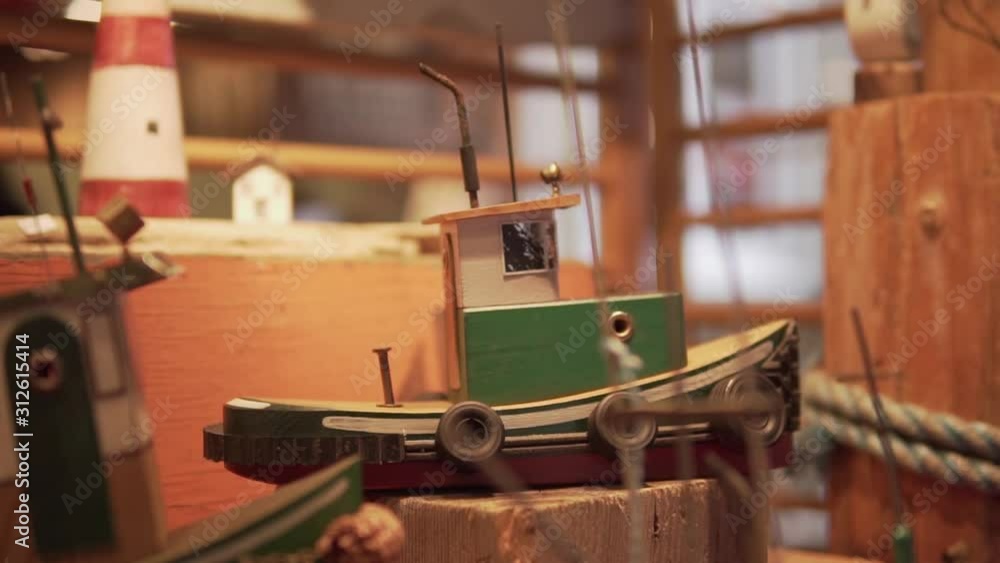 Wooden toy boat in Vancouver Canada. This was taken at a regular speed with natural motion blur. Wooden toy boat in Vancouver Canada. This was taken at a regular speed with natural motion blur.