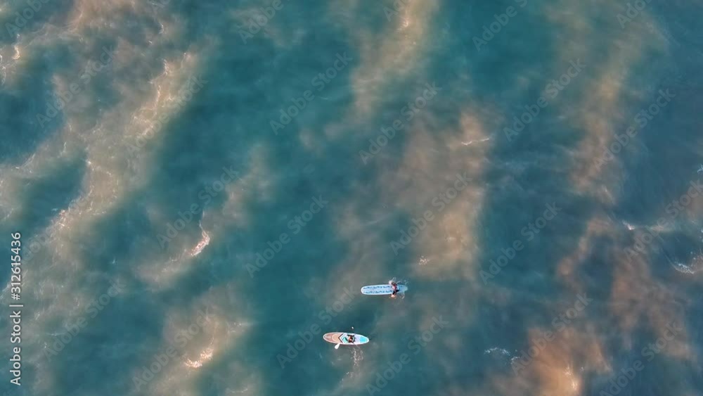 Two surfers hitting their morning run. When you combine sunrise and the waves of Lake Michigan. The drone footage look something like that of a lucid dream. Two surfers hitting their morning run. When you combine sunrise and the waves of Lake Michigan. The drone footage look something like that of a lucid dream.