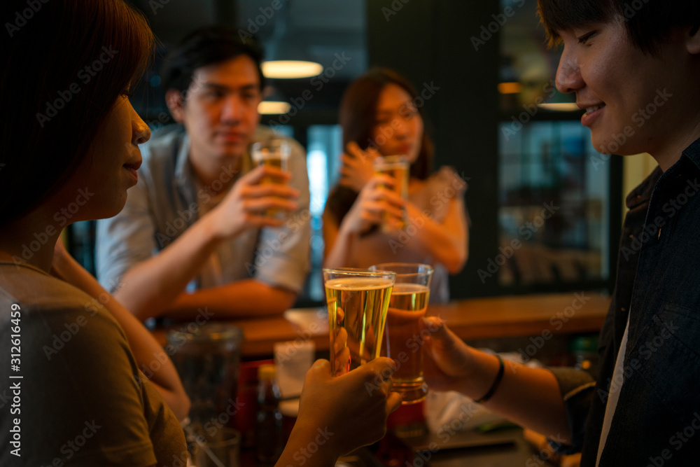 Group of friend enjoying drink beer at bar