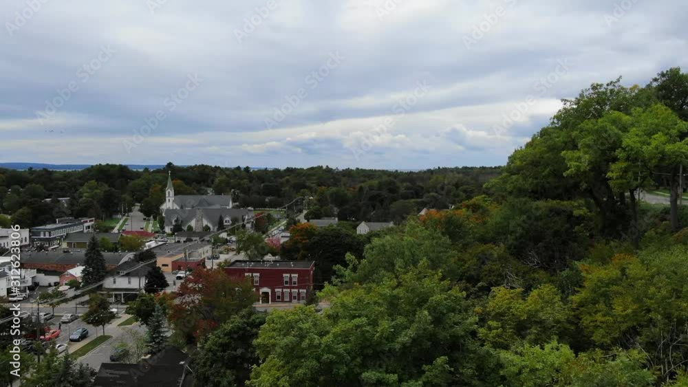 The Beautiful Town of Harbor Springs located in Northern Michigan during Fall Colors small town USA with church in distance The Beautiful Town of Harbor Springs located in Northern Michigan during Fall Colors small town USA with church in distance