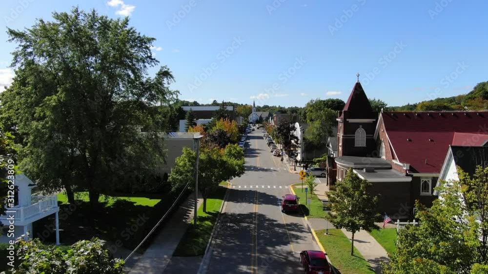 The Beautiful Town of Harbor Springs located in Northern Michigan during Fall Colors looking down main street in small town America The Beautiful Town of Harbor Springs located in Northern Michigan during Fall Colors looking down main street in small town America