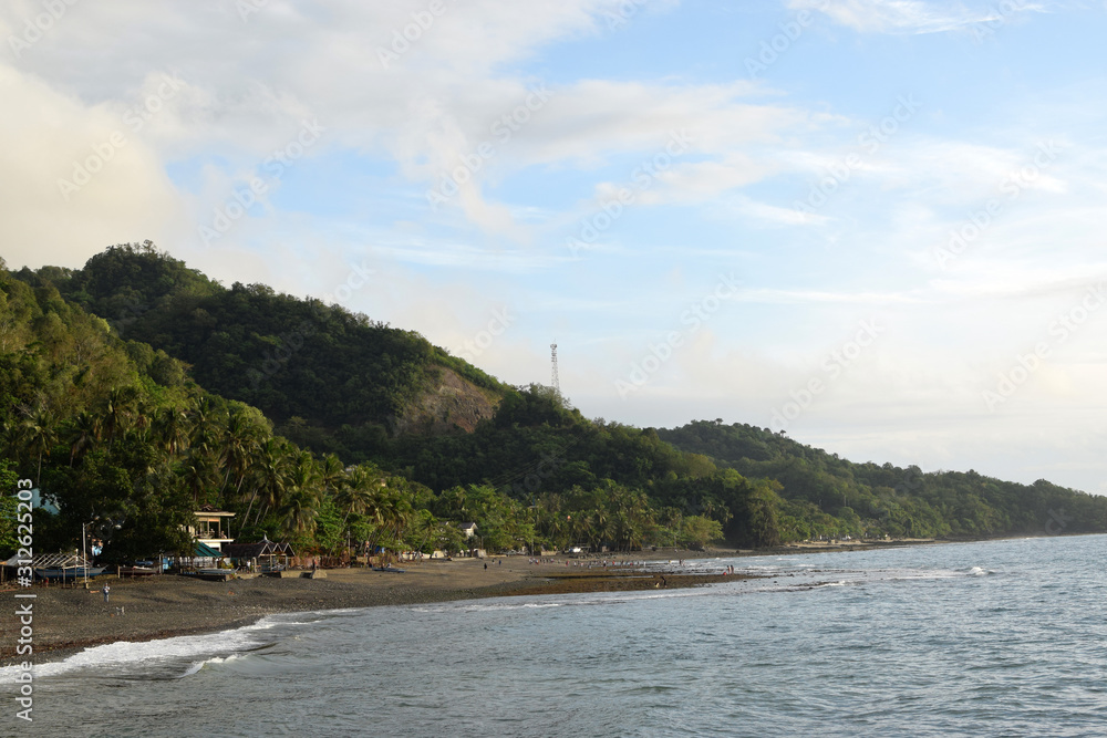 San Juan, Batangas, Philippines - December 26, 2019: Tropical island beach resort along sea shore