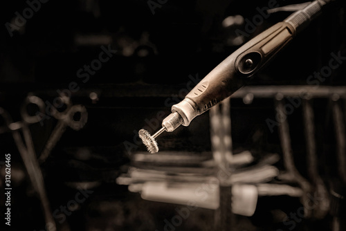 Rotary tool in a dark background photo