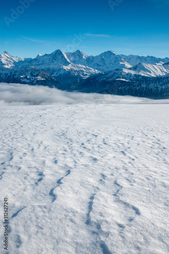 Eiger Mönch and Jungfrau in winter with snow drifts