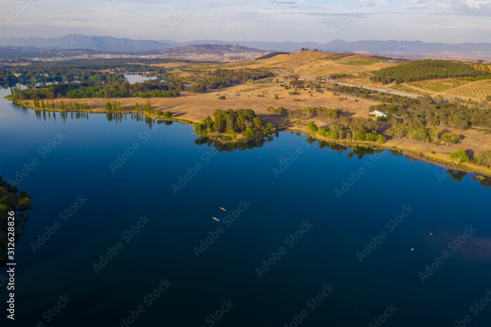 Aerial panoramic view of Lake Burley Griffin looking south toward Molonglo River with kayakers in the waters on a sunny morning 