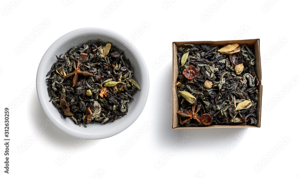 Green tea with aromatic additives. Top view on white background Green tea with aromatic additives. Top view on white background