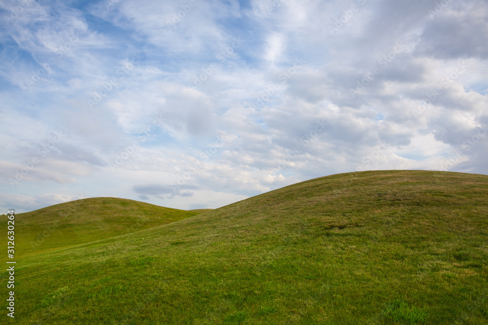 Golf course with blue sky background.