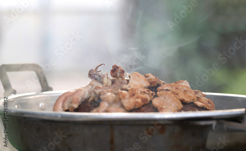 Grilling sliced pork and meat on hot pan (Pan Pork) asian style with ingredients and sauce