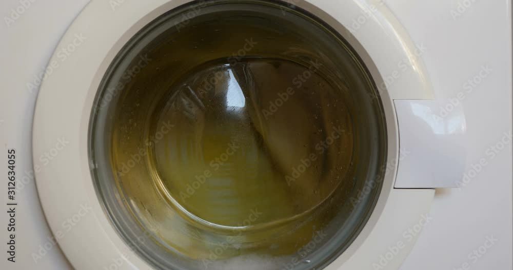 Close up washing machine at work. C4k, DCI video. Close up washing machine at work. C4k, DCI video.