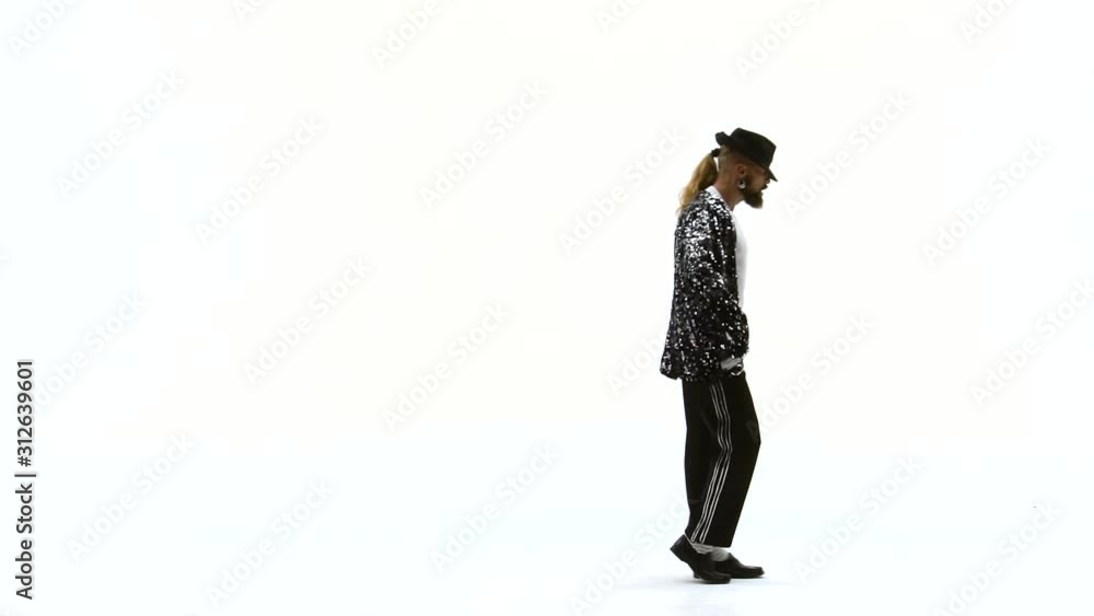 Young stylish teenager is showing dance moves. Isolated over white background. Close up, slow motion. Young stylish teenager is showing dance moves. Isolated over white background. Close up, slow motion.