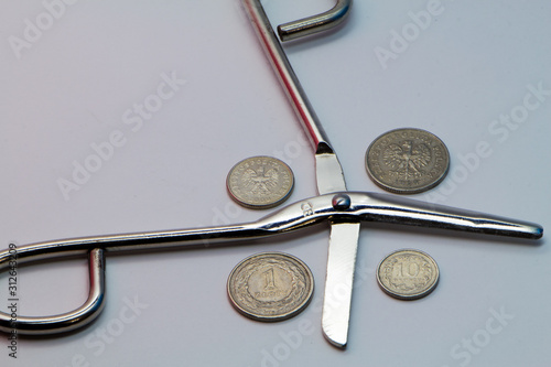 compass and coins on white background