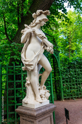 Sculpture of Roman goddess of war Bellona in old city park 