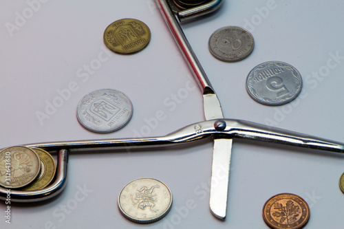 coins and watch on white background