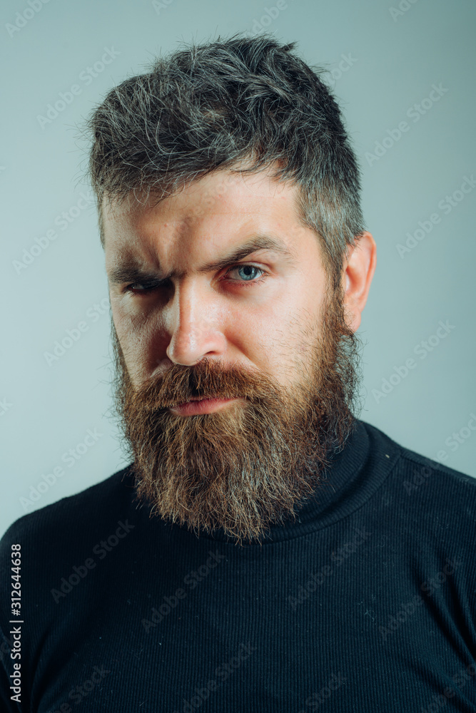 Handsome bearded man. Brutal hipster boy. Confident concept. Urban lifestyle concept. Man with confident face and brutal style isolated. Barbershop advertising. Copy space. Handsome bearded man. Brutal hipster boy. Confident concept. Urban lifestyle concept. Man with confident face and brutal style isolated. Barbershop advertising. Copy space.