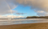Beach, castle and rainbow.