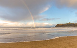 Beach, castle and rainbow.