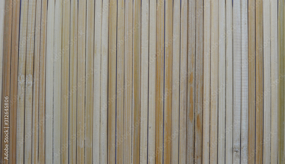 Rural background from light wooden planks in vertical parallel pattern. Wood wall facade fragment texture. Rural background from light wooden planks in vertical parallel pattern. Wood wall facade fragment texture.