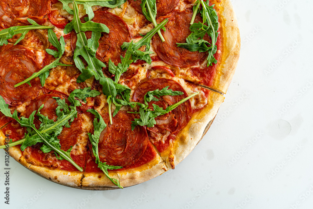 Closeup pepperoni pizza on the white table