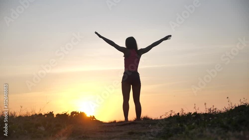 Wallpaper Mural Happy woman jumping on beach enjoying sunset on summer travel vacation holiday. Happiness and bliss concept video with female jumping of joy celebrating in silhouette. SLOW MOTION 4k Torontodigital.ca