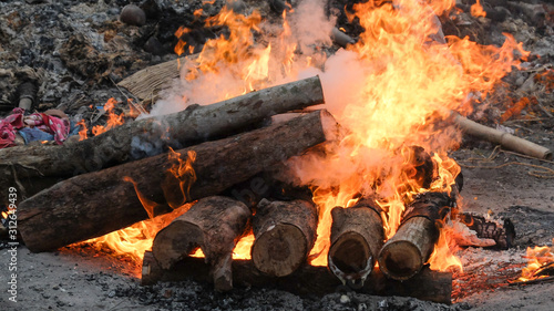 A funeral pyre burning intensely at Swargadwar crematorium,Puri,Odisha state,India.