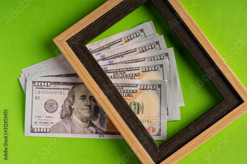 US Dollar bills against green background photo