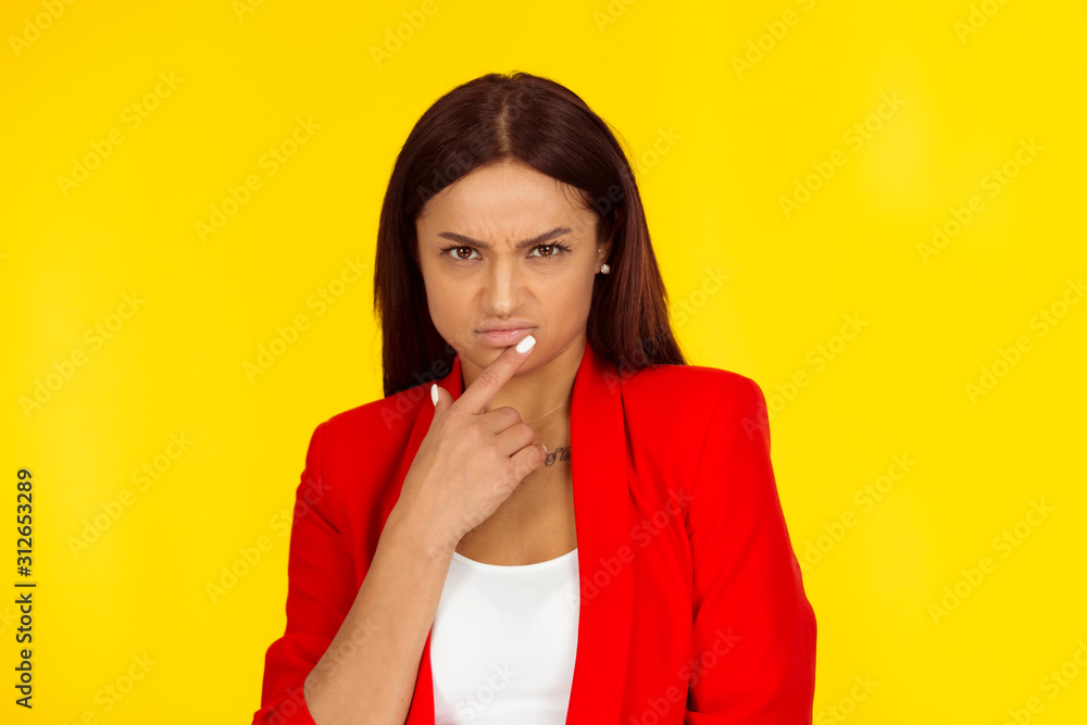 Annoyed upset skeptical woman frowning Annoyed upset skeptical woman frowning