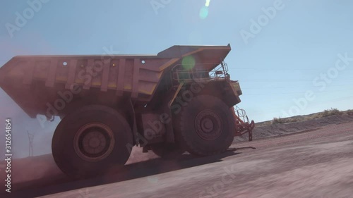 huge mining truck is driving fast in Africa