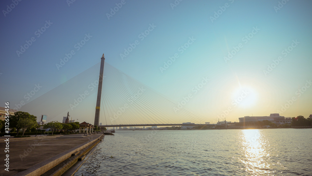 Obraz premium Thailand, Bangkok, view of the Rama VIII Bridge and the Chao Praya river at sunset