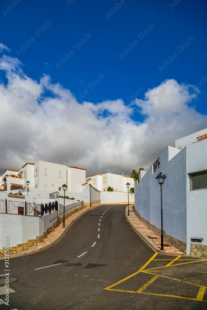 Street with typical Canary style holiday apartments Street with typical Canary style holiday apartments