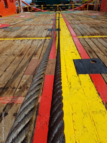 Work or towing wire laid on deck of an anchor handling tugboat photo